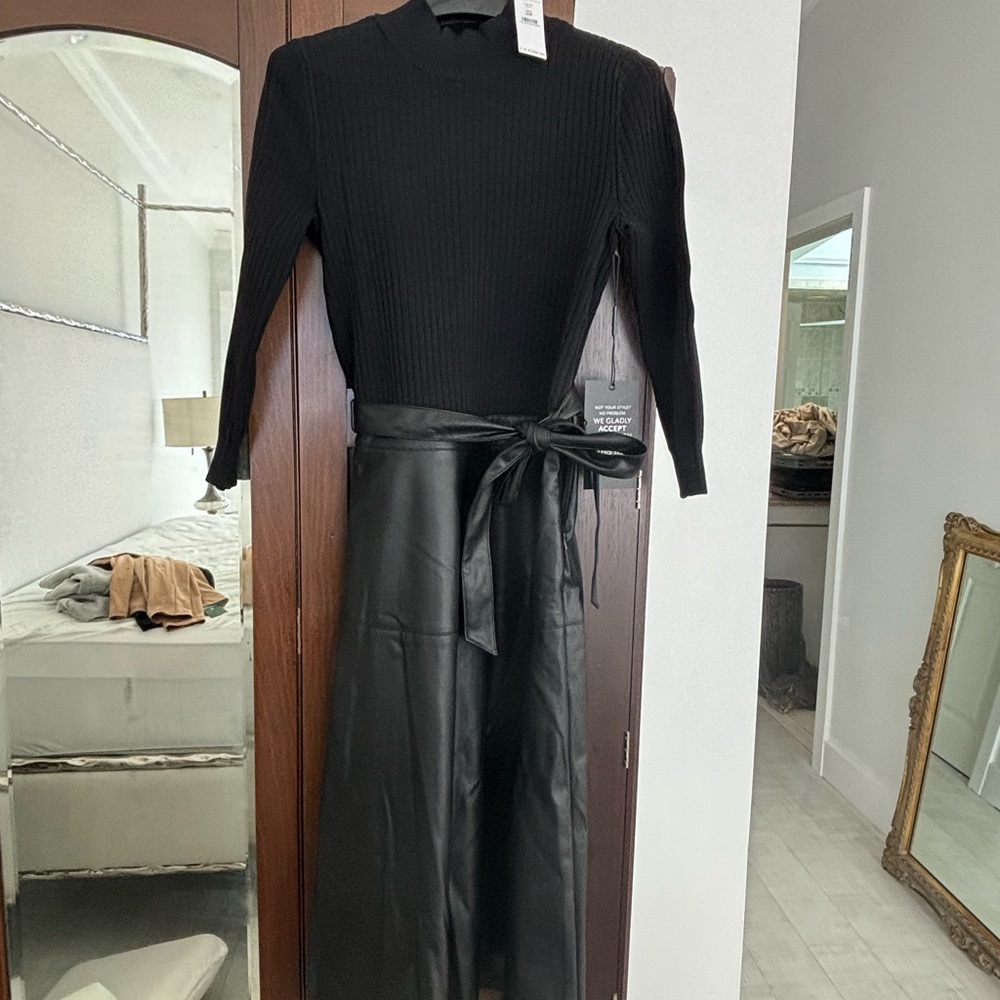 White House Black Market Black sweater dress with minus the leather skirt. Chic!